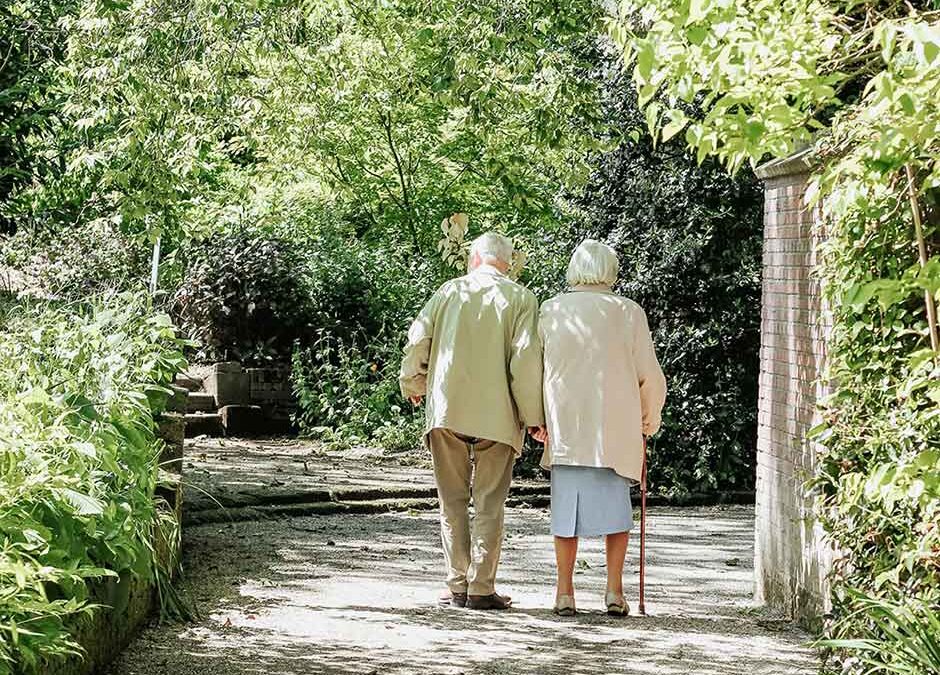 Photo of elderly couple walking